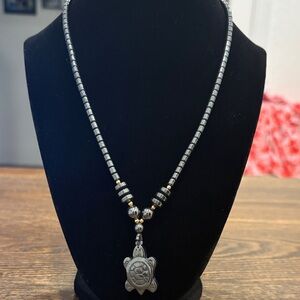 Elegant Hematite and Gold Turtle Pendant Necklace with matching bracelet
